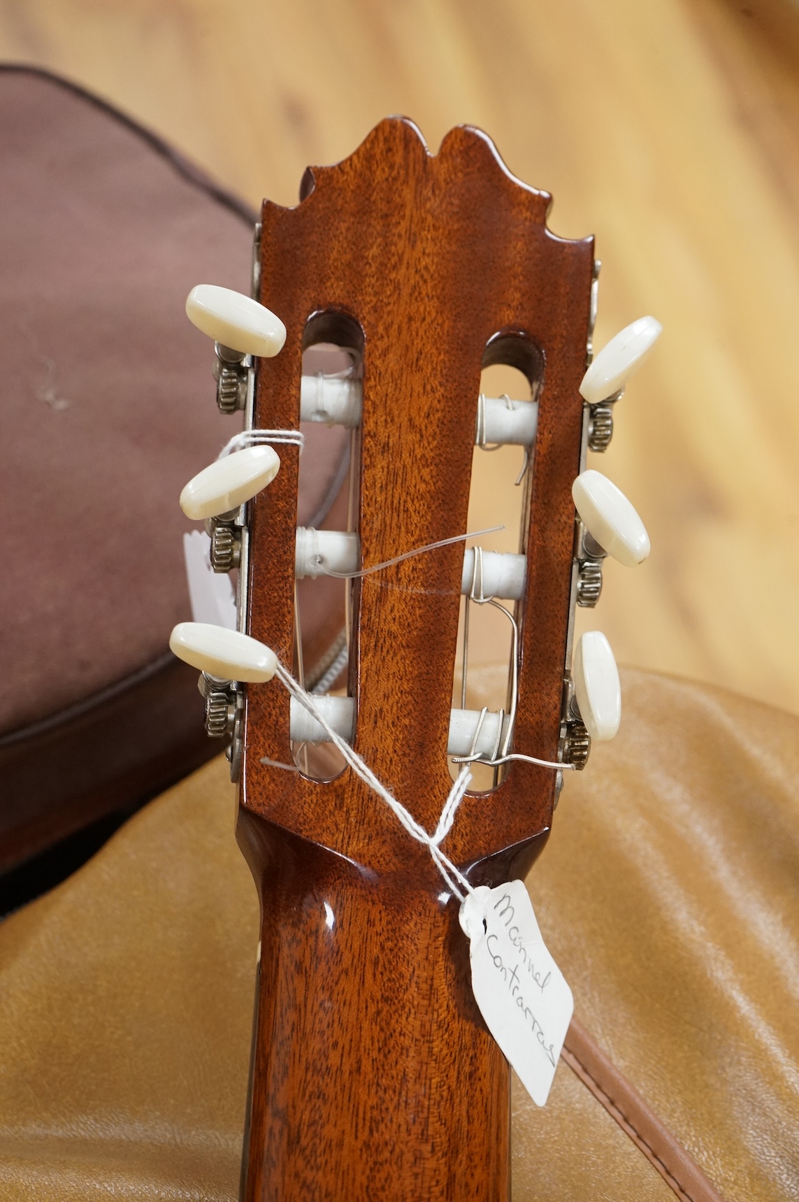 A Spanish Manuel Contreras classical guitar, with cedar front, Indian rosewood back sides and ebony fingerboard, with makers label inside body; M.G. Contreras, Madrid, back 49cm